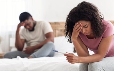 Woman feeling stressed after negative pregnancy test highlighting infertility concerns