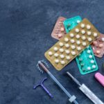 birth control pills and fertility concept woman planning pregnancy